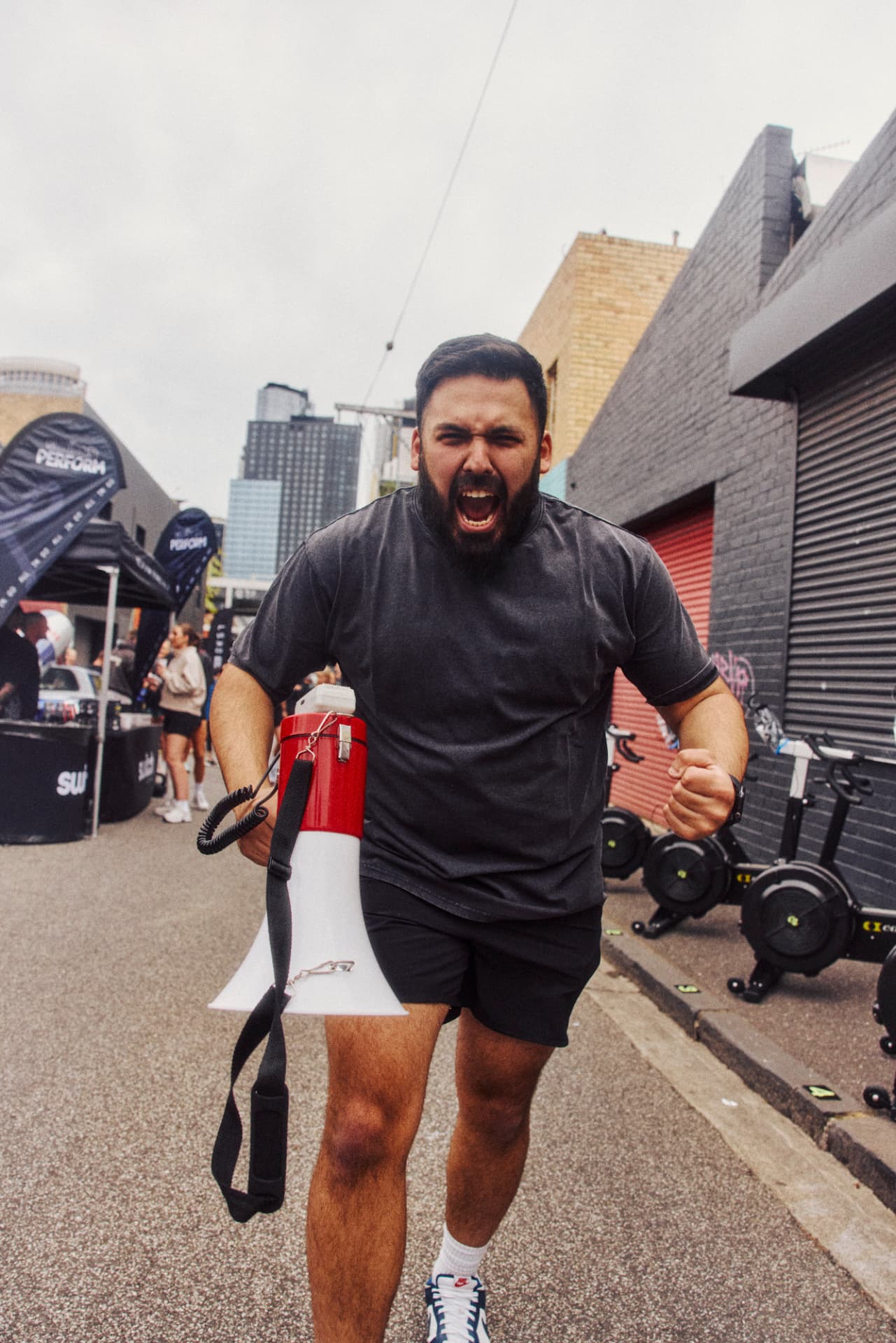 Coach roaring encouragement down the race lane
